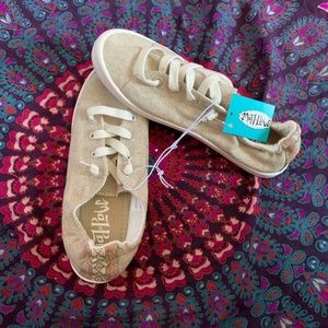 Size 7 Slip on shoes. Unworn.